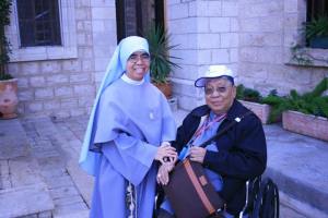 Bishop Gutierrez with a Filipina sister outside the Wedding Church at Cana in Galilee