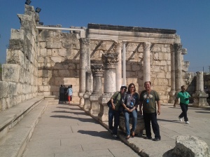 The group, at the back is the Old Synagogue in Capharnaum
