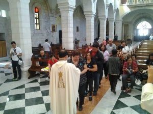 Fr. Roming S. during Holy Communion distribution at st. catherine church