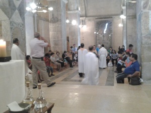 co-pilgrims before the Mass at crusader church
